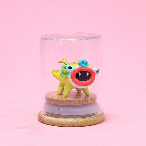 6 images of baby dragon sculptures each in a small glass jar