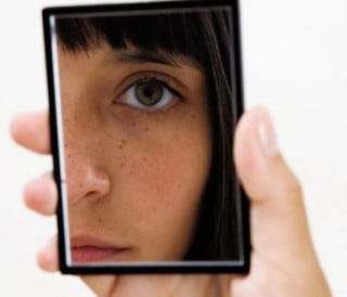 girl-looking-in-mirror