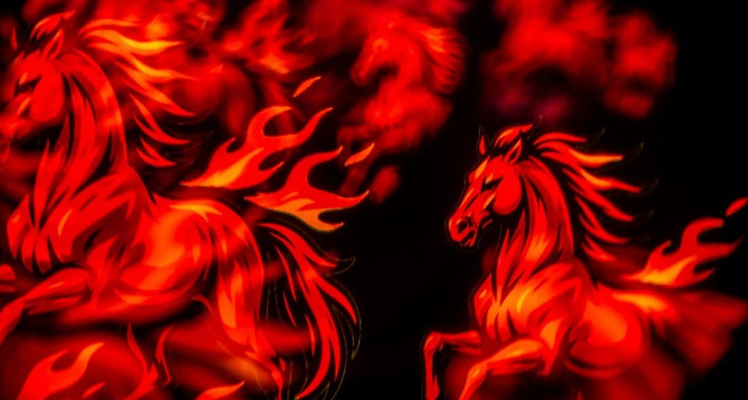 Two horses made of fire running
