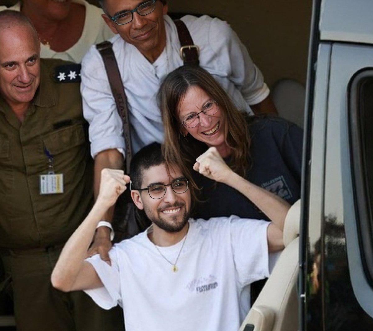 Group of four individuals stand beside a white van with open door. Leftmost wears military uniform with stars on shoulders and name tag. Next wears light shirt and glasses smiling. Woman in glasses and brown hair smiles. Young man with short dark hair beard glasses white t-shirt gold chain raises both fists smiling. All appear joyful in outdoor setting.