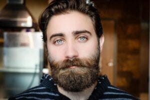 bearded man with striking blue eyes