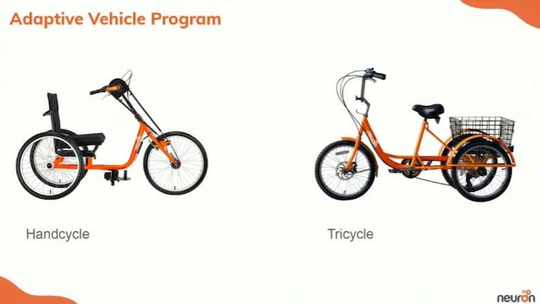 A slide from a sldieshow shows a handcycle and an adult tricycle. Both are orange and black
