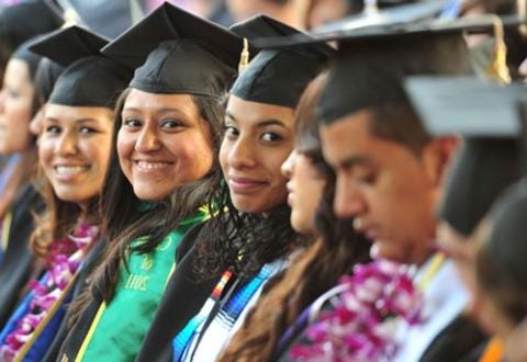 A group of people in graduation caps

Description automatically generated