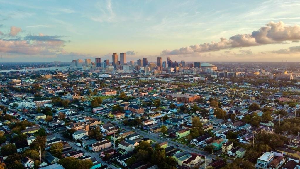 A city with a large city in the background
AI-generated content may be incorrect.