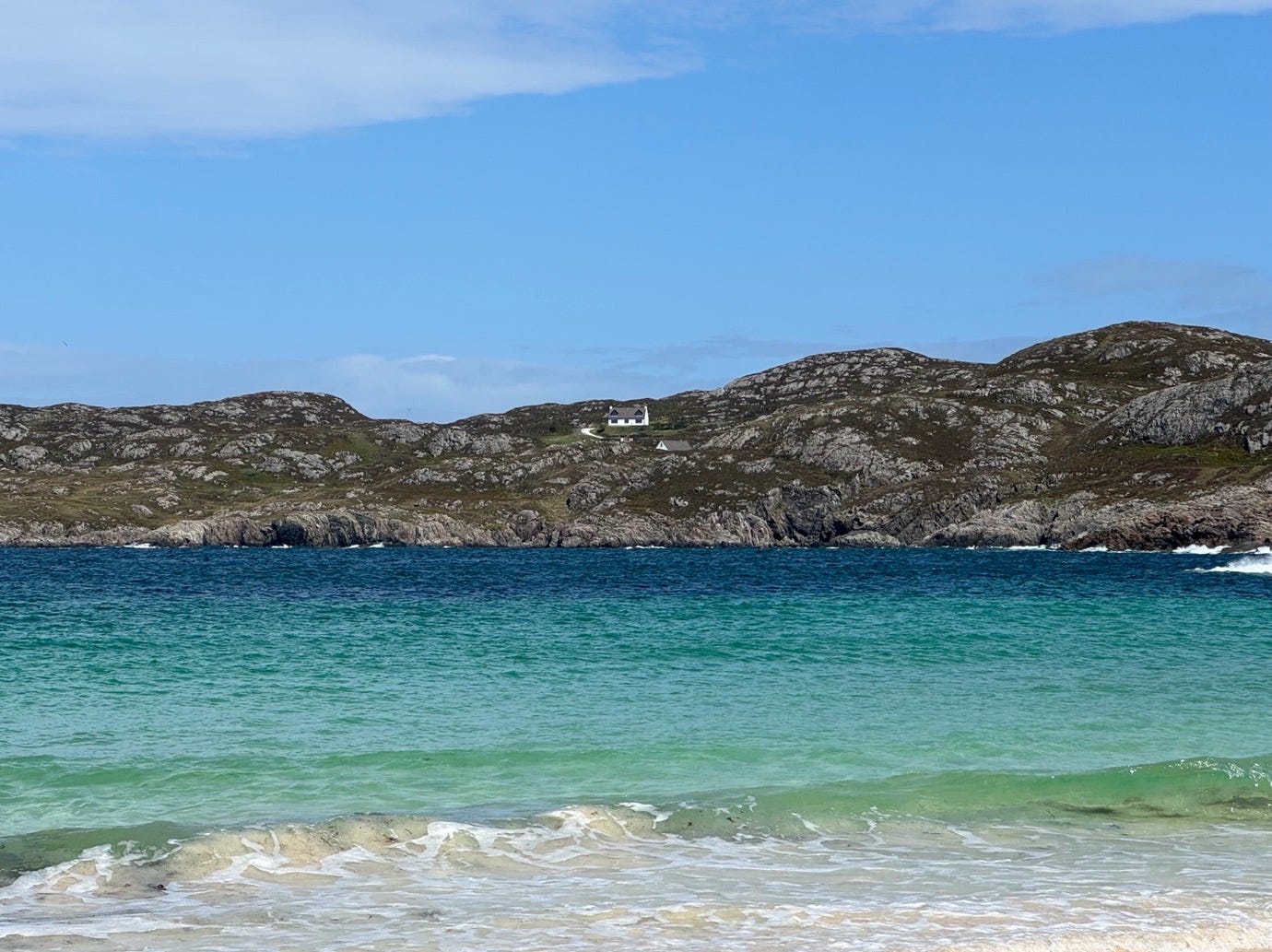 A body of water with hills in the background

AI-generated content may be incorrect.