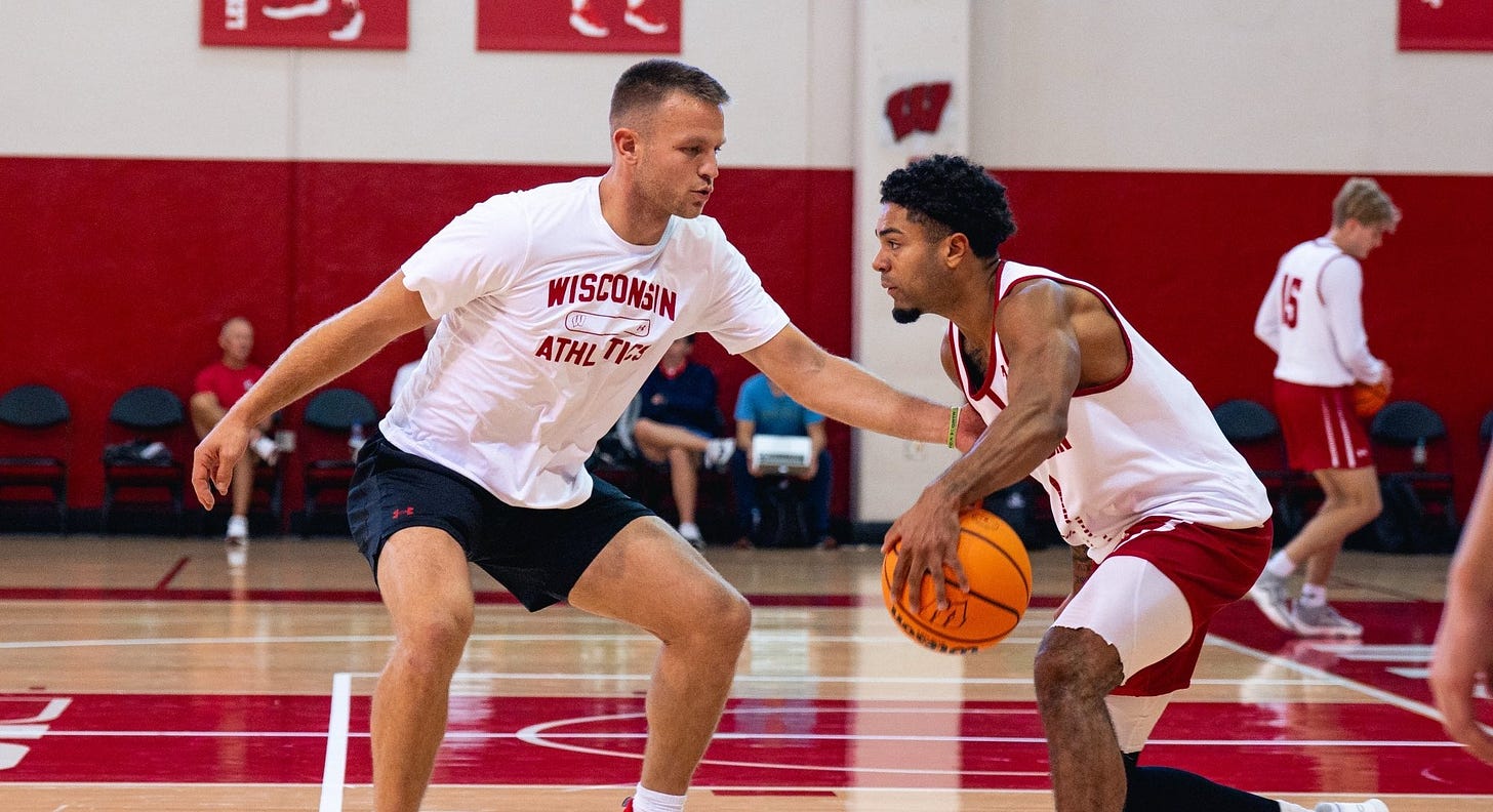 Wisconsin Badgers Special Assistant Brad Davison guards point guard Nick Boyd in practice at the Kohl Center.