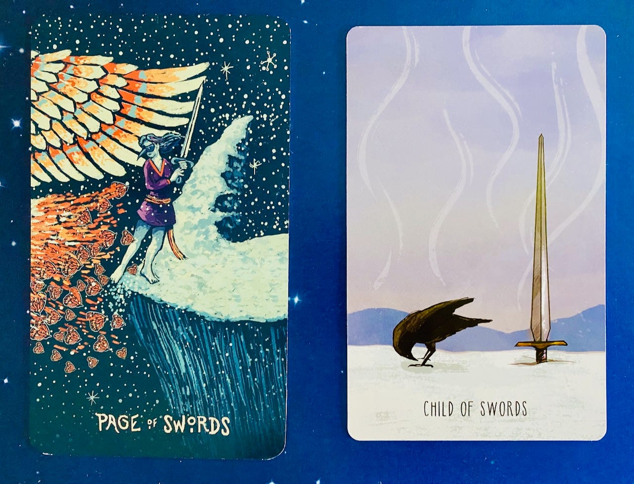 Two tarot cards on a blue background, the Page and Child of Swords. The Page depicts a young woman in a beaked mask standing on a snowy cliff edge, swinging a sword, approached by a cloud of monarch butterflies. The Child card shows a sword stuck, handle-down, in the snow, and a little crow looking at it upside-down through her little twig legs.