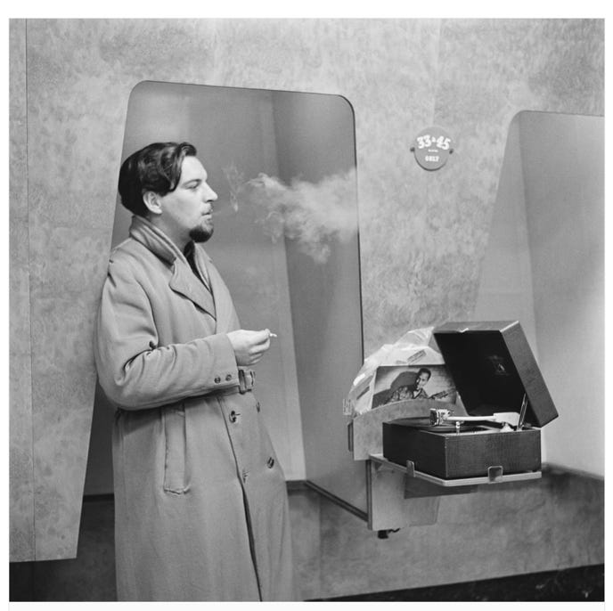 A person smoking a cigarette

Description automatically generated