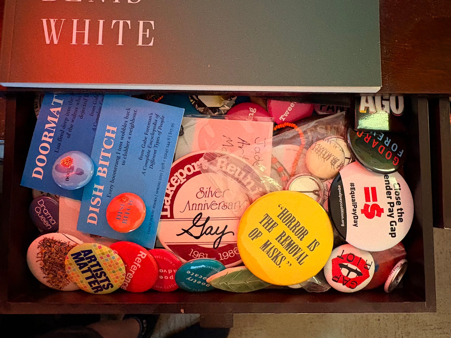 An open drawerful of Kirby's button collection.