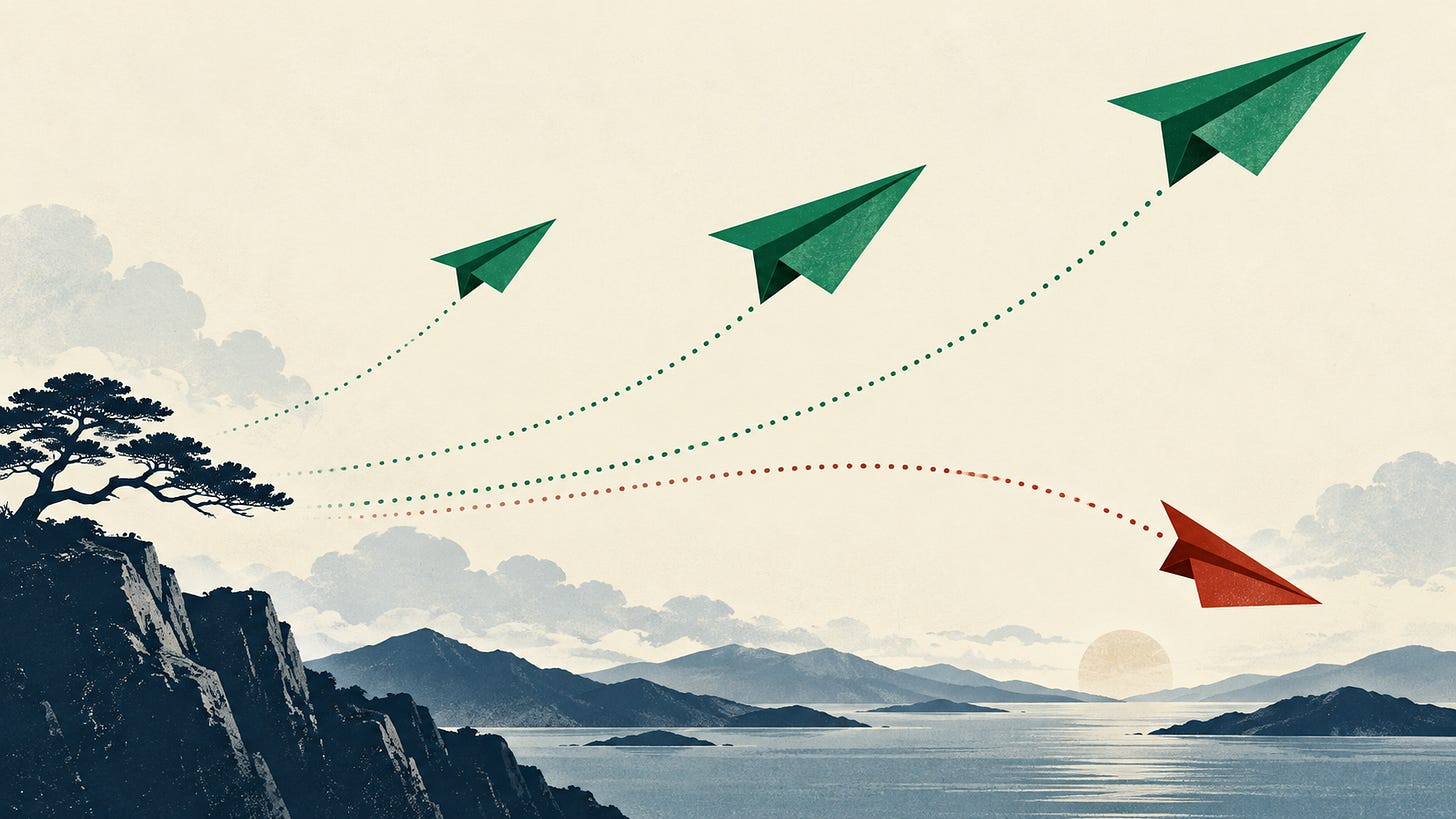 Three green paper airplanes rising and one red airplane descending.