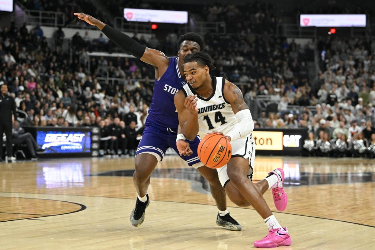 Providence College guard Corey Floyd Jr. drives against Stonehill's Josh Morgan during the first half Saturday at Amica Mutual Pavilion.