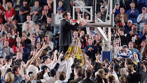 Coach K cutting the nets