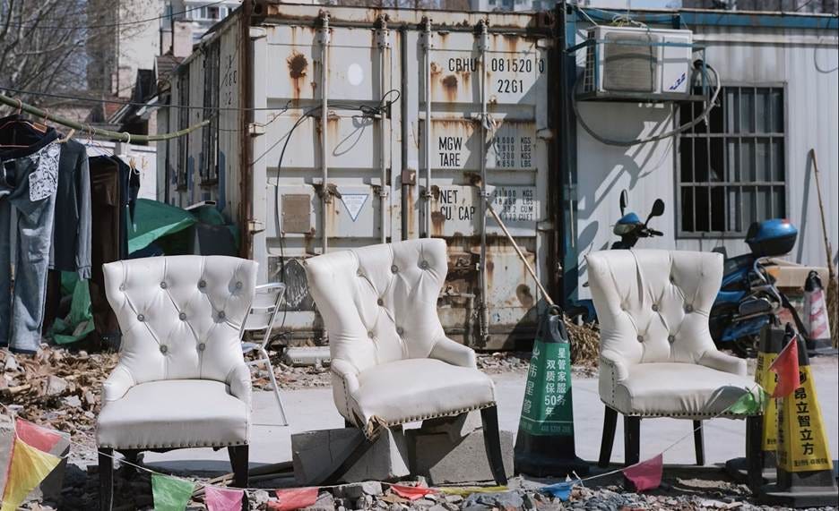 Several white chairs outside

AI-generated content may be incorrect.