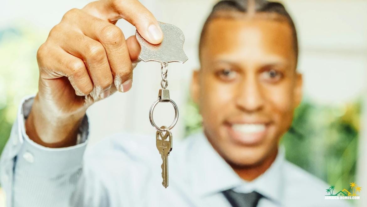 man in white dress shirt holding a silver key man in white dress shirt holding a silver key