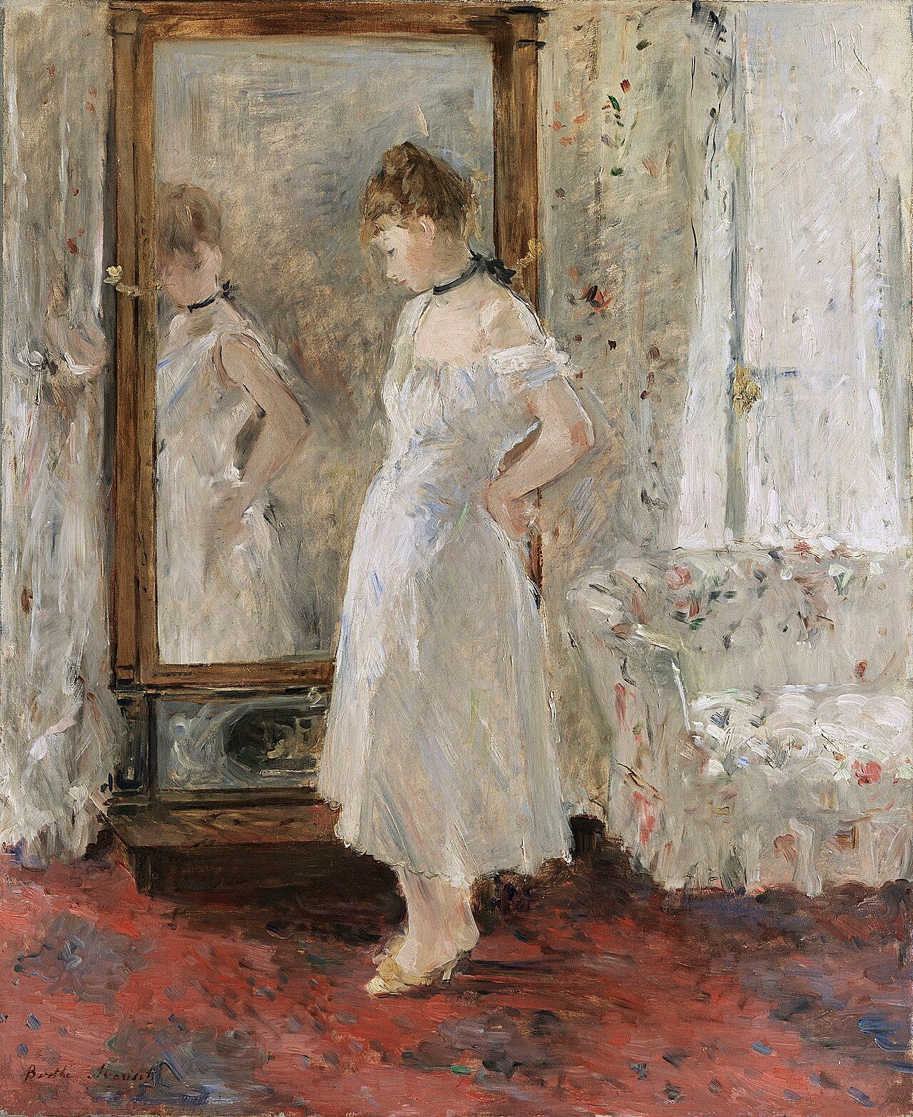 Morisot's The Psyche Mirror: a young woman in a white blouse standing before a tall dressing mirror in a bedroom, seen from behind