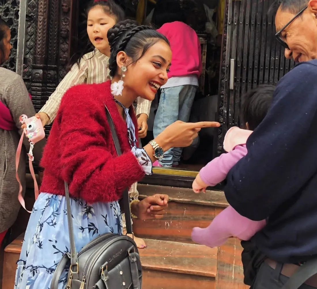 woman smiling at a baby woman smiling at a baby