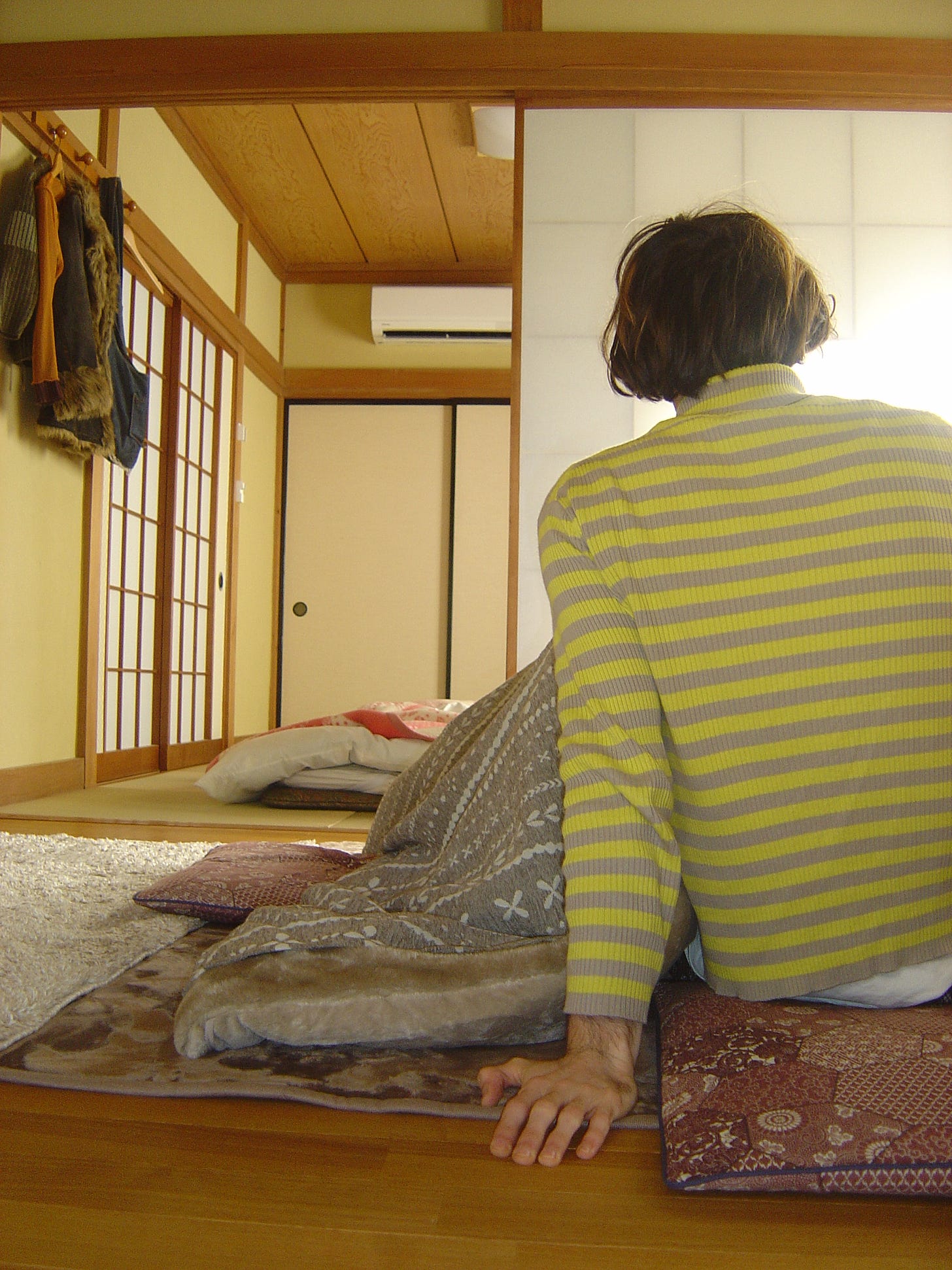Theo sitted at a Kotatsu table.
