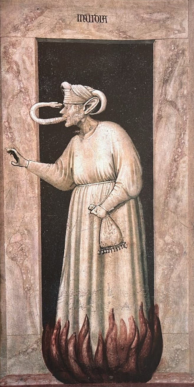 L’Invidia di Giotto: un serpente esce dalla bocca della figura e si ritorce verso gli occhi, mentre le fiamme salgono ai suoi piedi. L’Invidia di Giotto: un serpente esce dalla bocca della figura e si ritorce verso gli occhi, mentre le fiamme salgono ai suoi piedi.