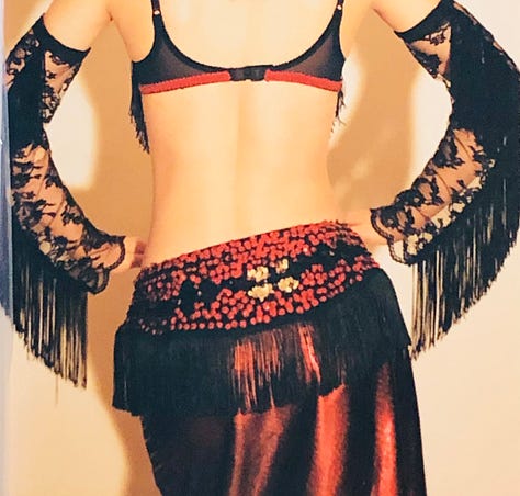 The author in a variety of belly dance costumes from her restaurant days.