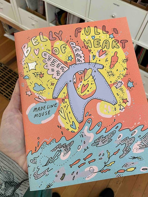 5 images with books being held by a hand and a tabletop covered in Graphic Novels. Titles include: Belly Full of Heart; In Limbo; Special Topics in Being a Parent; Viewfinder; Princess Princess