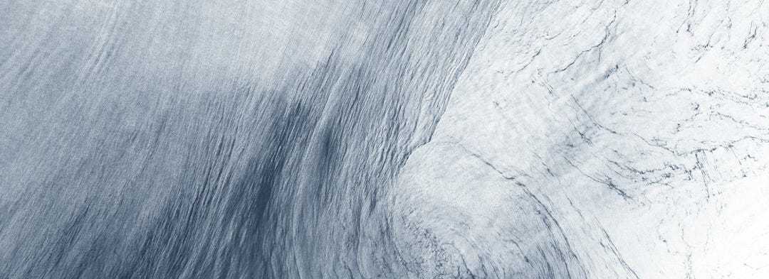 a blue and white photo of a swirl in the sky a blue and white photo of a swirl in the sky