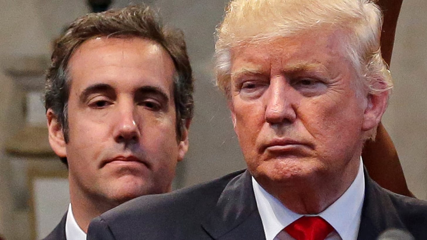 Republican presidential nominee Donald Trump's personal attorney Michael Cohen stands behind Trump.