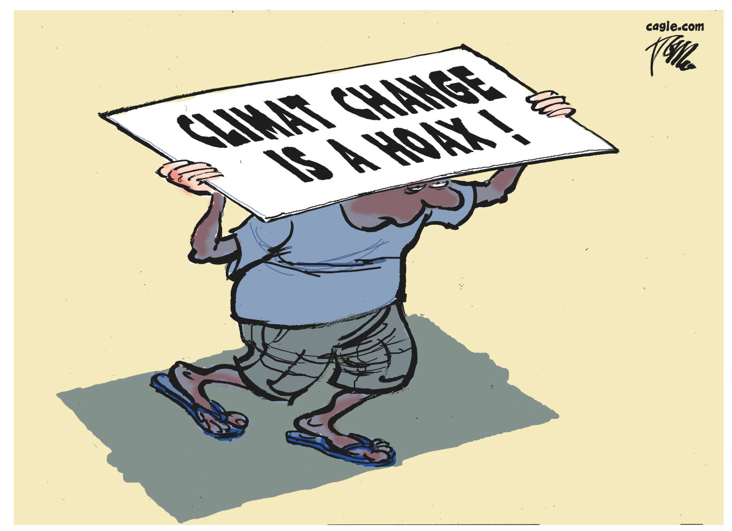 A man tries to shade himself from the sun with a misspelled sign that reads, “Climat change is a hoax!” A man tries to shade himself from the sun with a misspelled sign that reads, “Climat change is a hoax!”