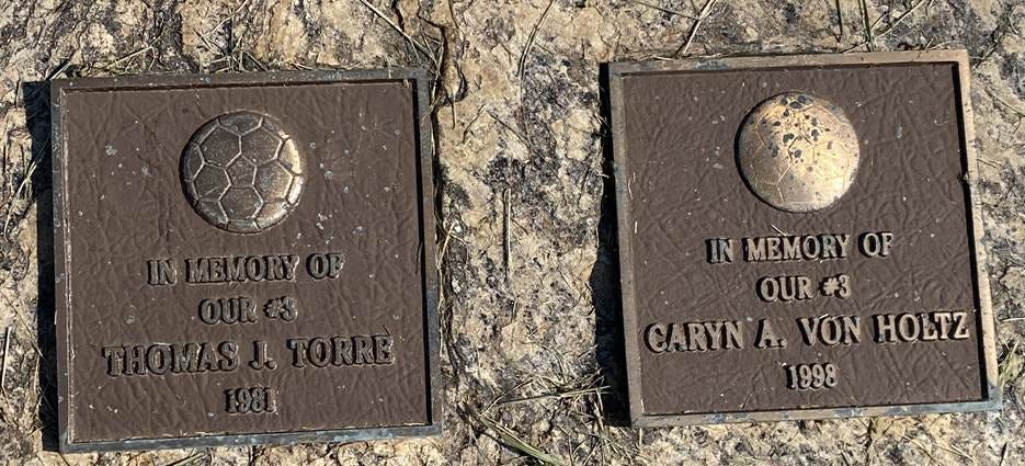 A close-up of a plaque

AI-generated content may be incorrect.