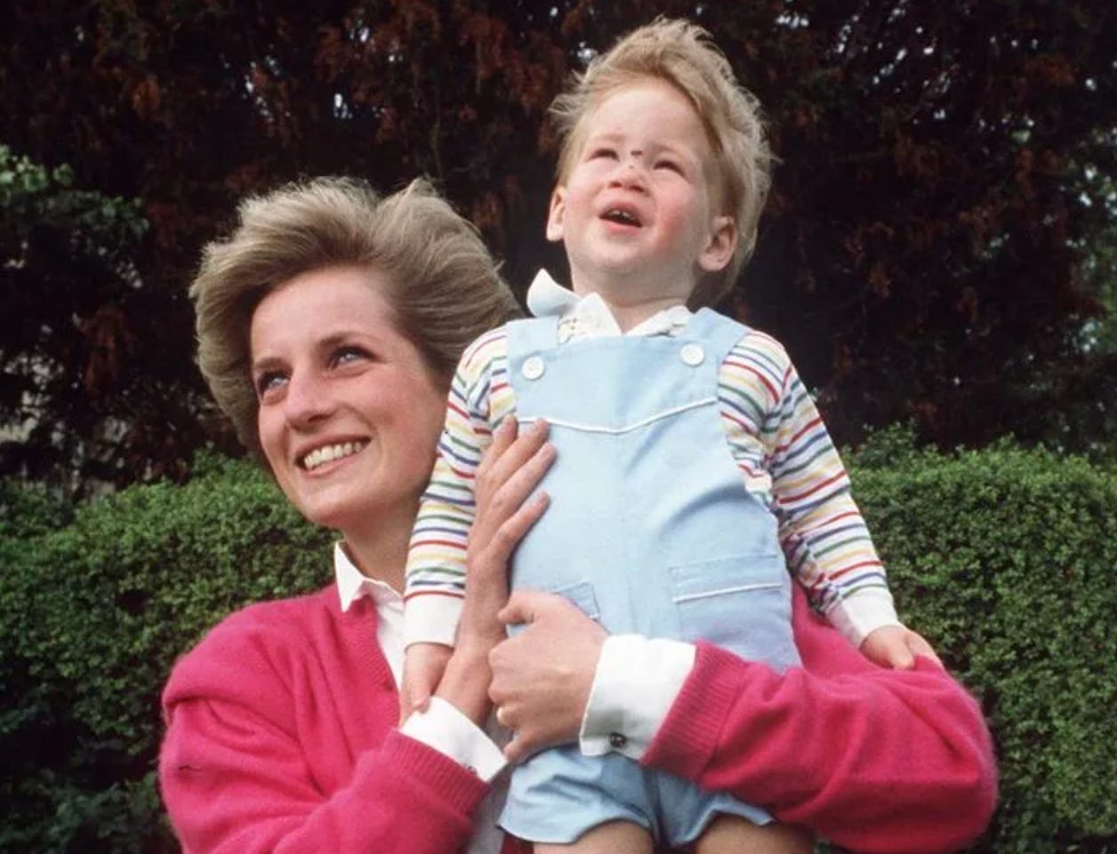 Princess Diana holding Harry