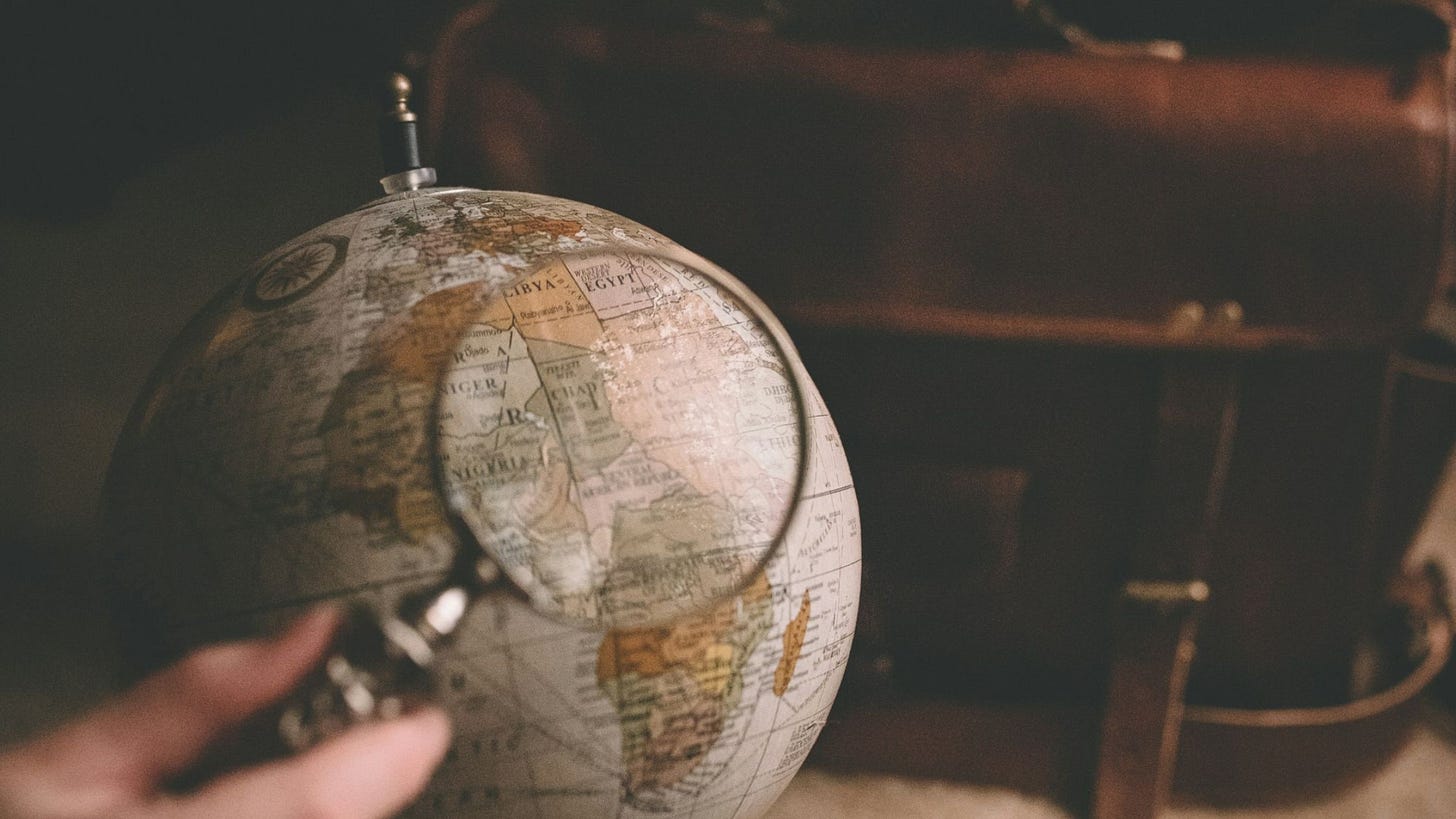 Picture of a globe with magnifying glass to symbolise international SEO for professional services firms.