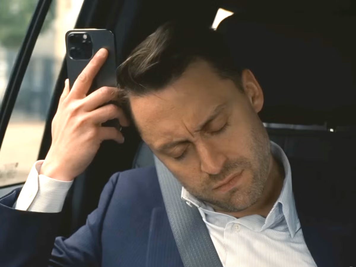 Roman Roy from Succession on a call, symbolizing startup founders navigating investor calls and funding stress Roman Roy from Succession on a call, symbolizing startup founders navigating investor calls and funding stress