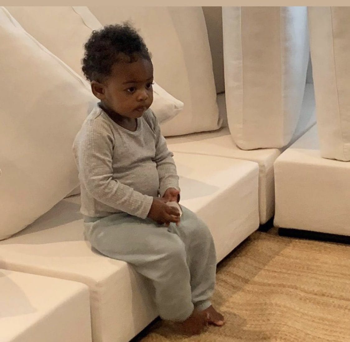 baby sitting solemnly