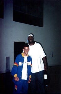 Photo: Amin Eshaiker / Wikimedia Commons (CC BY-SA 4.0) Professional basketball player Harold Jamison ( right ) posing with a fan after a 2002 Summer Pro League game (in which he played) at The Pyramid in Long Beach, California.