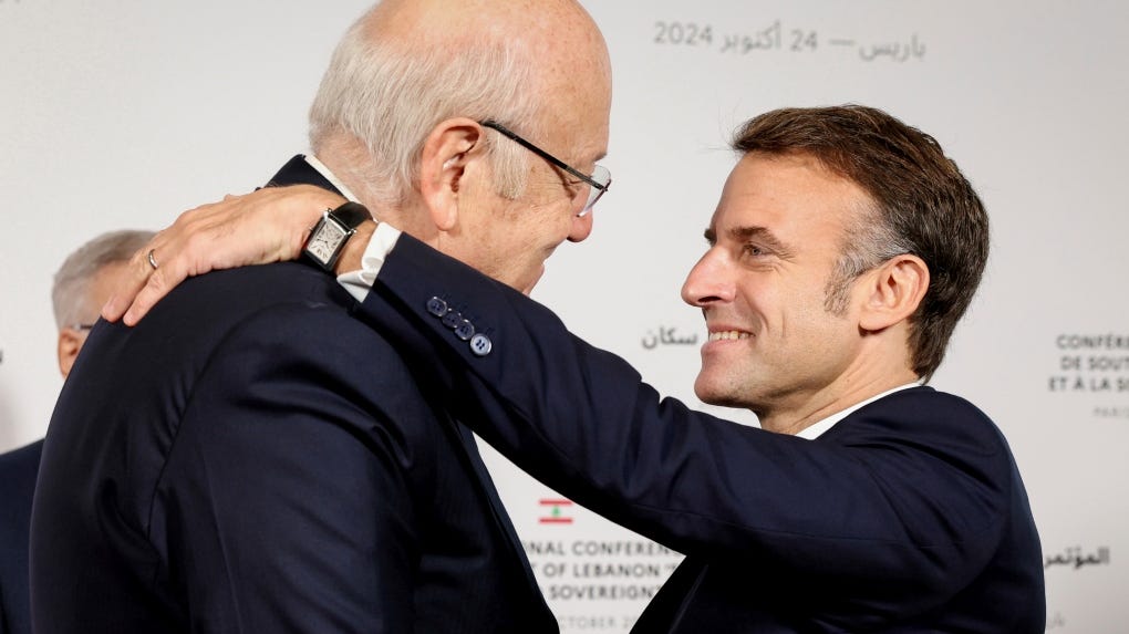 French President Emmanuel Macron hugs Lebanon's Prime Minister Najib Mikati, left, in Paris on Oct.24, 2024. (Alain Jocard, Pool via AP) French President Emmanuel Macron hugs Lebanon's Prime Minister Najib Mikati, left, in Paris on Oct.24, 2024. (Alain Jocard, Pool via AP)