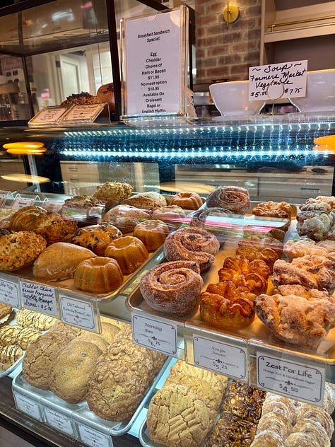 labyrinth walk, Parisian-style pastries in a case, and wood steps along a nature path