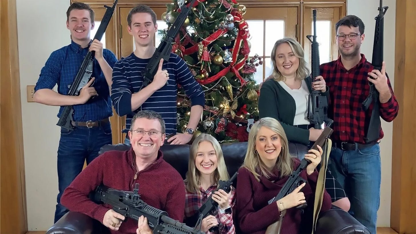 Thomas Massie family at Christmas tree with lots of guns