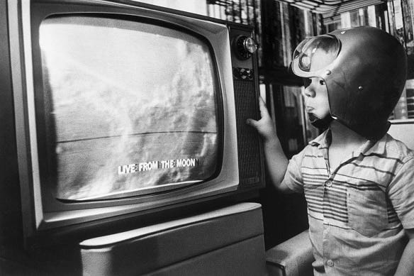 A boy watches an unmanned Moon landing on television in 1965. The 1960s was the height of Space Race fascination. (Getty Images: Bettmann)