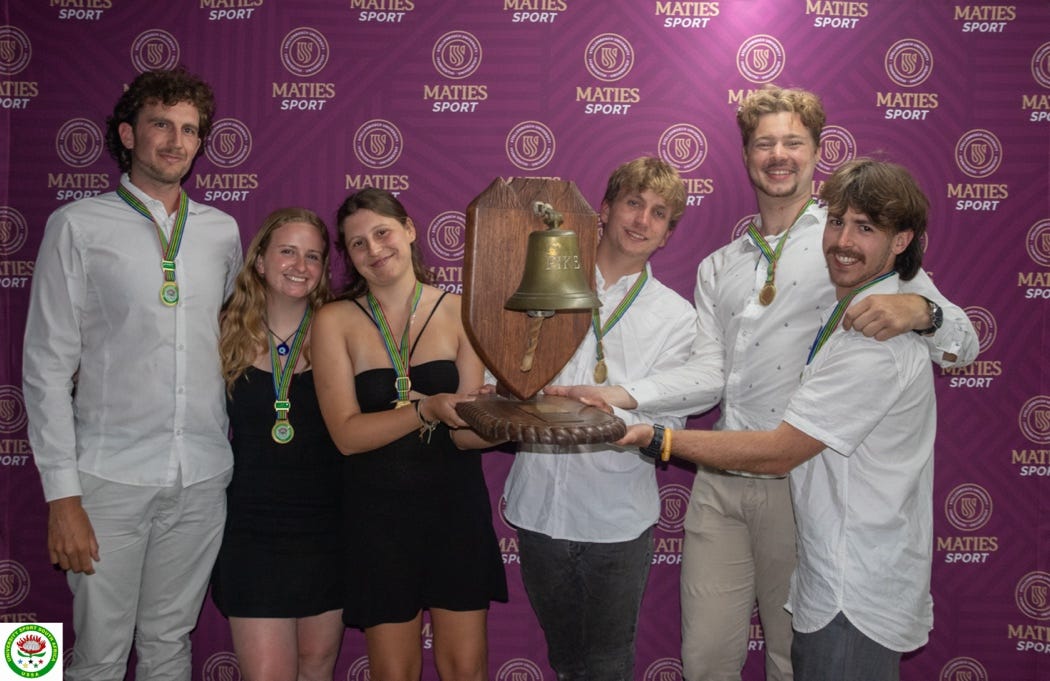 A group of people posing for a photo

Description automatically generated