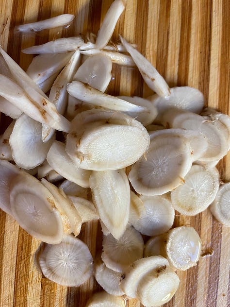 Left/top Sliced burdock root, center,  tossed in a pan with bacon fat, Left/bottom,  stir fried to desired doneness. 