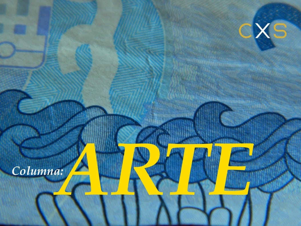 A close up of a paper bill with a cupcake on it