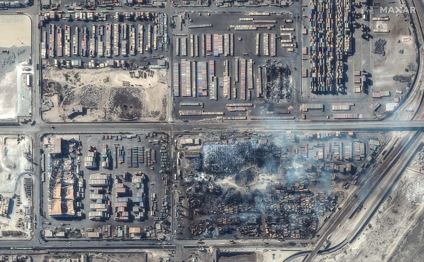 Satellite imagery of Shahid Rajaee port following a fire and explosion. Imagery by Maxar