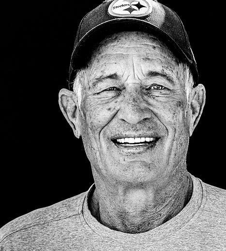 Black and white portrait of a man with a cap. Black and white portrait of a man with a cap.