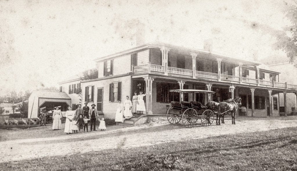 Joseph Silver with his family in front of the Clark Hotel which he owned