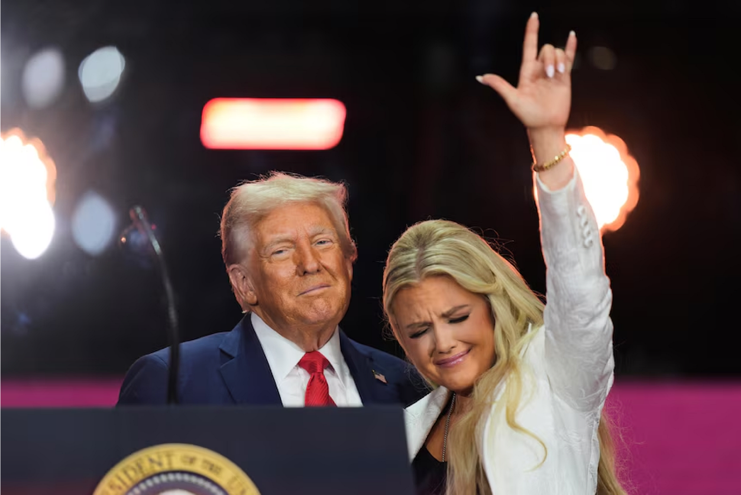 At the moment Christian faith should speak loudest, she raised the horned hand — the ancient sign of inversion.