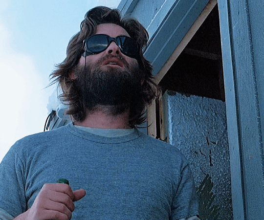 MacReady (Kurt Russell) looking especially ravenous in the 90;’s John Carptenter Thriller, The Thing. 