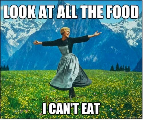 A woman happily dancing in the Alps saying: "Look at all the food I can't eat"