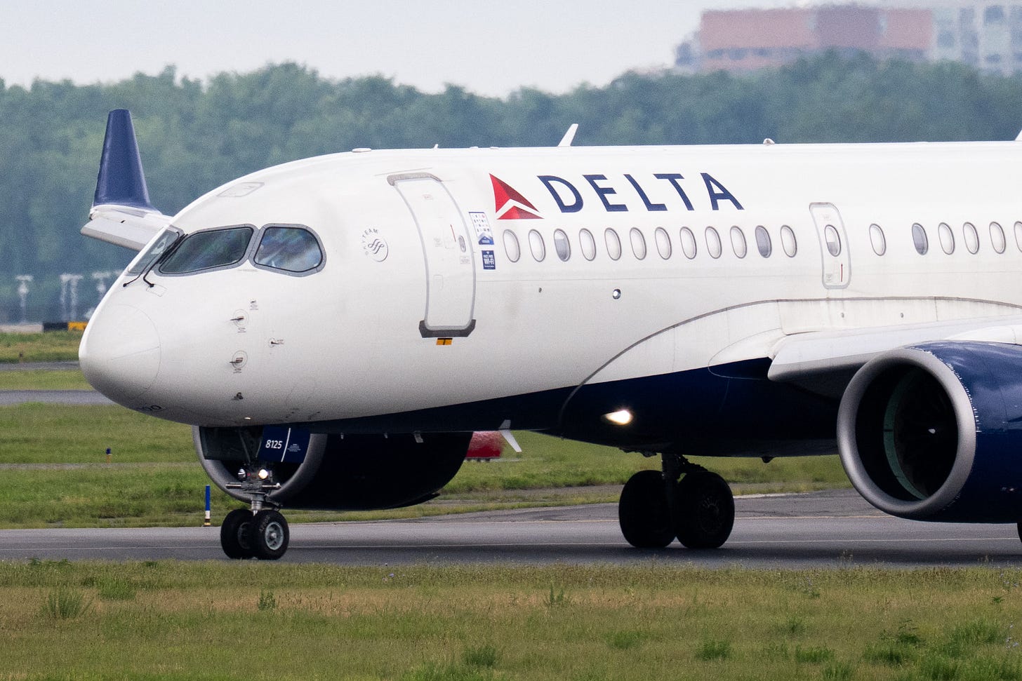 A Delta Air Lines Airbus A220 airplane prepares to takeoff at Ronald Reagan Washington National Airport in Arlington, Virginia, on July 10, 2025.