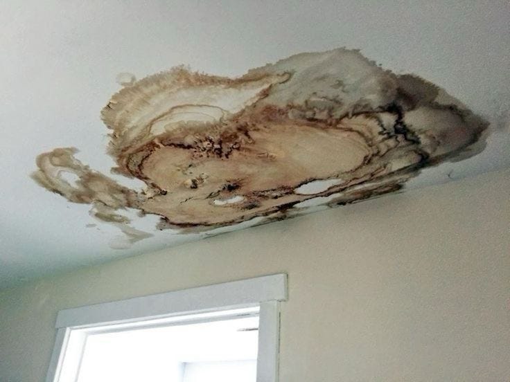 This may contain: the ceiling is covered in moldy brown stuff