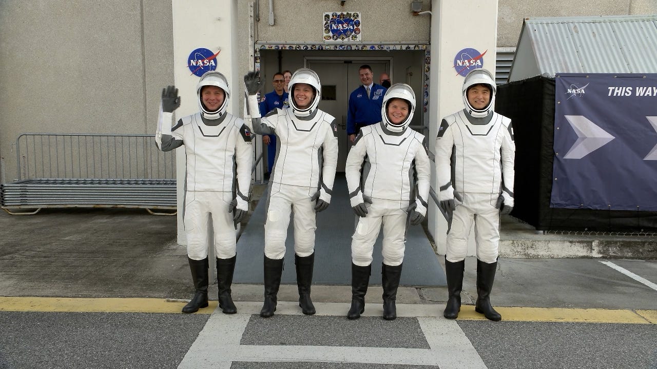 Image shows NASA's SpaceX Crew-10 astronauts waving to family and friends. Image shows NASA's SpaceX Crew-10 astronauts waving to family and friends.