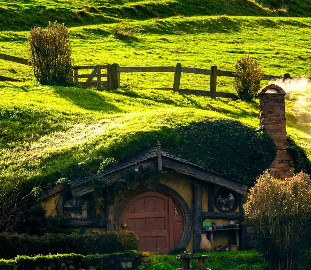 A hobbot house in a lush green field A hobbot house in a lush green field